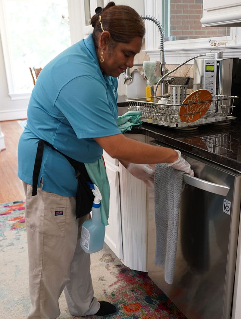 PCT Clean employee performing maid services for Kennesaw, GA home